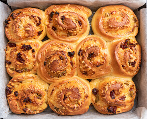 Sweet norwegian swirls cinnamon rolls in a tray, photo from above