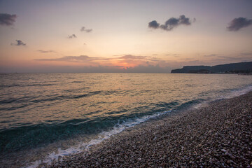 The embankment in the Turkish city of Kemer. The coastline. The Mediterranean Sea. Dawn on the sea. Seashore. Dawn on the beach.