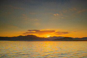 Fototapeta premium Flores, Indonesia – September 19, 2018: A beautiful sunset at the sea of Flores, Indonesia