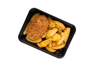 Lunch box with tasty potato wedges and cutlet. Food delivery. Top view. Isolated. Plastic container take away with tasty potato wedges and cutlet 