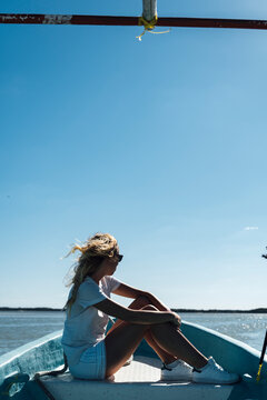 Middle aged woman and swim suit travelling in motorboat on sunny day at caribbean, Travel, Mexico, Lifestyle, quality of life, Deceleration
