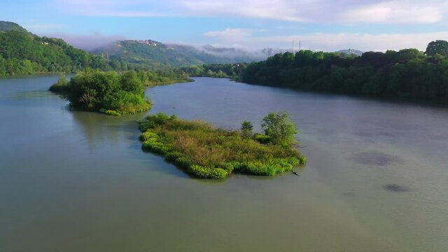 Tevere Farfa Nature Reserve, Nazzano, Lazio, Italy.
The river valley of the Tiber north of Rome. Aerial view with drone in 4K