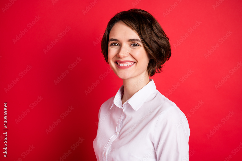 Wall mural photo portrait of happy business woman wearing white shirt smiling overjoyed isolated blank red colo