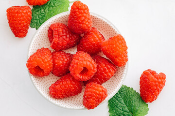 Fresh raspberries with mint leaves. Fresh fruit 