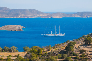 Fototapeta na wymiar Sailing ship in the bay of Patmos island. Panoramic view. Greece. 