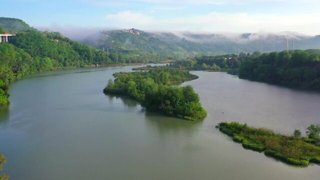 Tevere Farfa Nature Reserve, Nazzano, Lazio, Italy.
The river valley of the Tiber north of Rome. Aerial view with drone in 4K