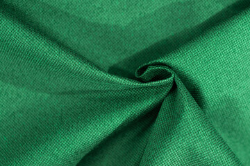 Luxury green fabric sample close-up. Can be used as background.