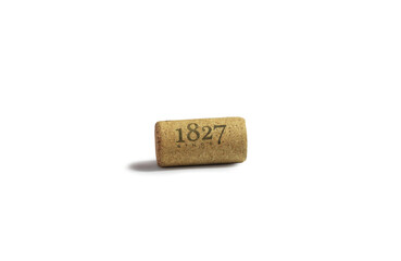 Used wine cork with date isolated on white background