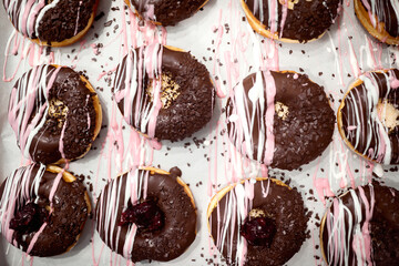 Closeup of delicious donuts ready for transport to pastry store. Pastry, dessert, sweet