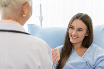 Fototapeta premium Senior older female doctor visit the patient room and make a history taking for diagnosis and cure process