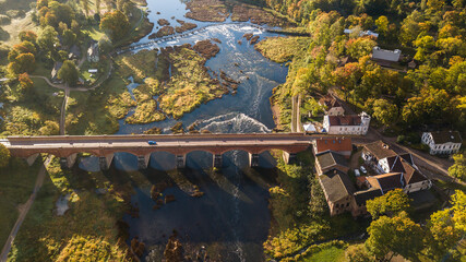 Venta Rapid waterfall, the widest waterfall in Europe and long brick bridge, Kuldiga, Latvia. Captured from above.