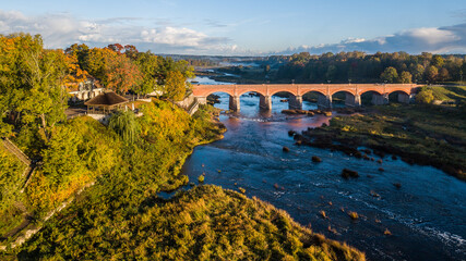 Fototapeta premium Long brick bridge, Kuldiga, Latvia. Captured from above.