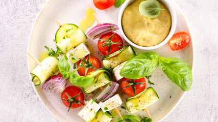 vegetables on skewer and dipping sauce