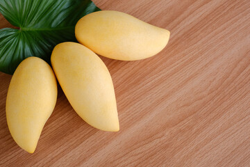 Mangoes fruit on wooden background