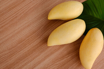 Mangoes fruit on wooden background