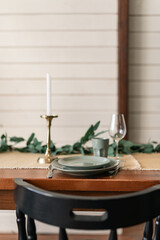 Close-up celebratory table, empty glasses set in home kitchen, family holidays celebration 