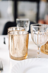 clean glasses and wineglass on table 