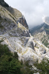 Ancient dirt road in the marble quarries on the Apuan mountains.Steep streets carved out of white marble lead to the marble quarries. Alpi Apuane, near Carrara, Italy.