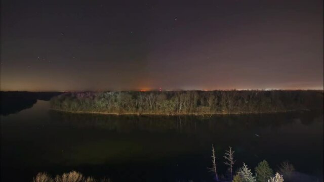 Night sky over Coosa River bank, time lapse