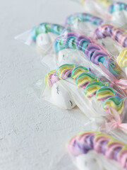 Airy meringue on a stick in the form of a unicorn.
