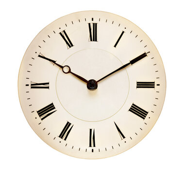 Ancient Clock face isolated against white background marks ten past ten. 