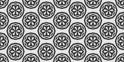 Abstract background pattern with black geometric elements on white background, wallpaper. Seamless pattern, texture. Vector graphics