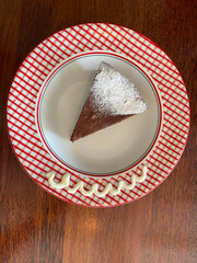 Sweet chocolate cake on a cute plate