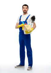 profession, service and people - male worker or cleaner in overal and gloves with cleaning supplies over white background