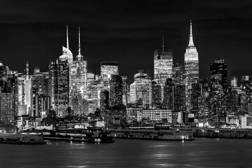 Fototapeta na wymiar West New York City midtown Manhattan skyline view from Boulevard East Old Glory Park over Hudson River at dusk.