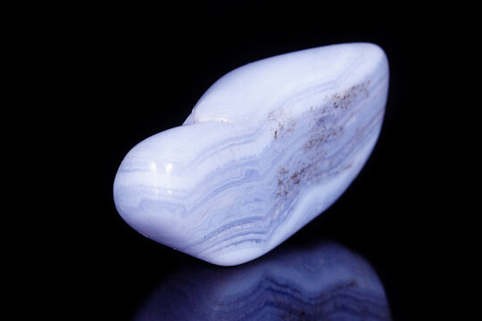 Macro mineral blue agate sapphirin in the rock on black background
