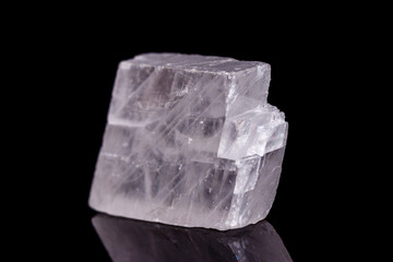 Macro mineral stone Iceland spar on black background