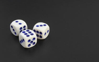 Dices on black table with room for text
