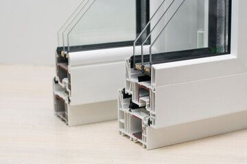 Samples of plastic windows in a section. close-up. PVC window profiles and double-glazed windows,...