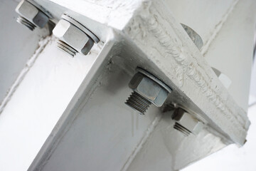 Metal construction with bolts and nuts. Close-up