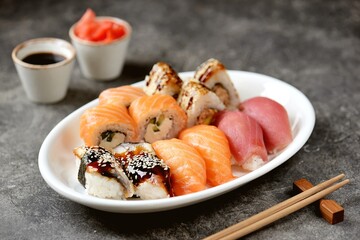 Sushi set with salmon, soft cheese, tuna, smoked eel. Healthy food. 