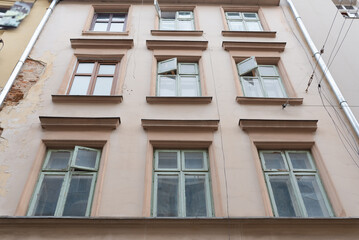 Cozy building facade with windows in the city
