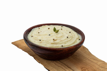 badam, kesar , pista shrikhand or amrakhand in a wooden bowl with food styling for food product packaging or social media 