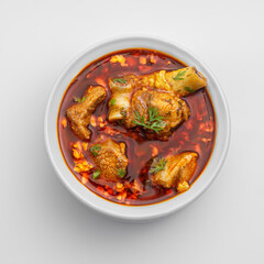 chicken or meat masala or curry in a white bowl on white background including red spicy gravy or curry 