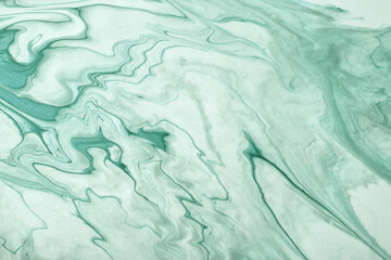 Abstract fluid art background blue and cyan colors. Liquid marble. Acrylic painting with turquoise gradient and splash.