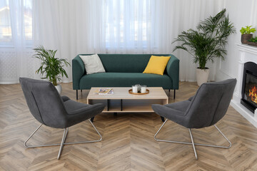 Stylish living room interior with comfortable sofa and armchairs