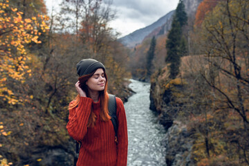 Naklejka premium woman hiker travels mountains rivers fresh air nature
