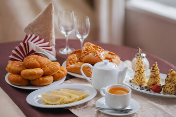 National Oriental sweets, cakes, kystybyi, tea with lemon in warm Golden tones