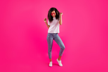 Full length body size view of pretty cheerful girl dancing having fun isolated over vivid pink fuchsia color background