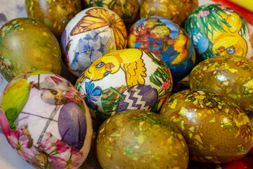 Fototapeta na wymiar colorful Easter eggs on a plate with a yellow background..eggs for the Easter holiday.