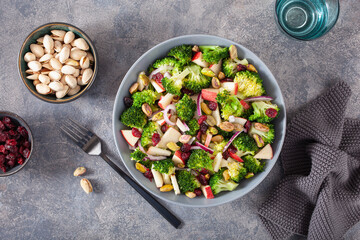 healthy broccoli salad with apple onion dried cranberries pistachio. vegan low carb diet