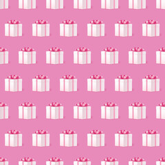 Seamless pattern with white gift box pink bow tie on pink background