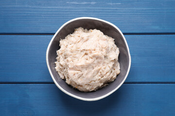 Delicious lard spread on blue wooden table, top view