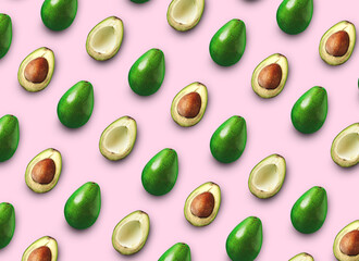 Avocado cut in half with bone isolated colored background.  Avocado on a pink background