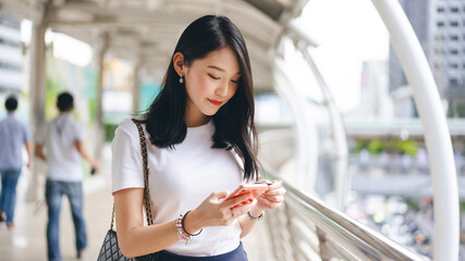 Young adult business asian woman consumer using creadit card and smartphone for shopping online. © dodotone