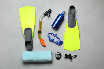 Flat lay composition with sports equipment on grey background